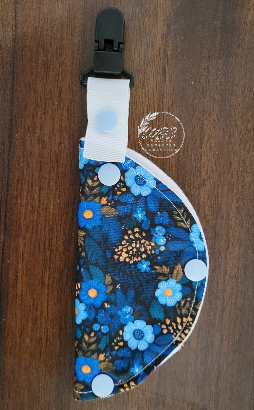 Clip on port cover with small blue flowers and some gold 