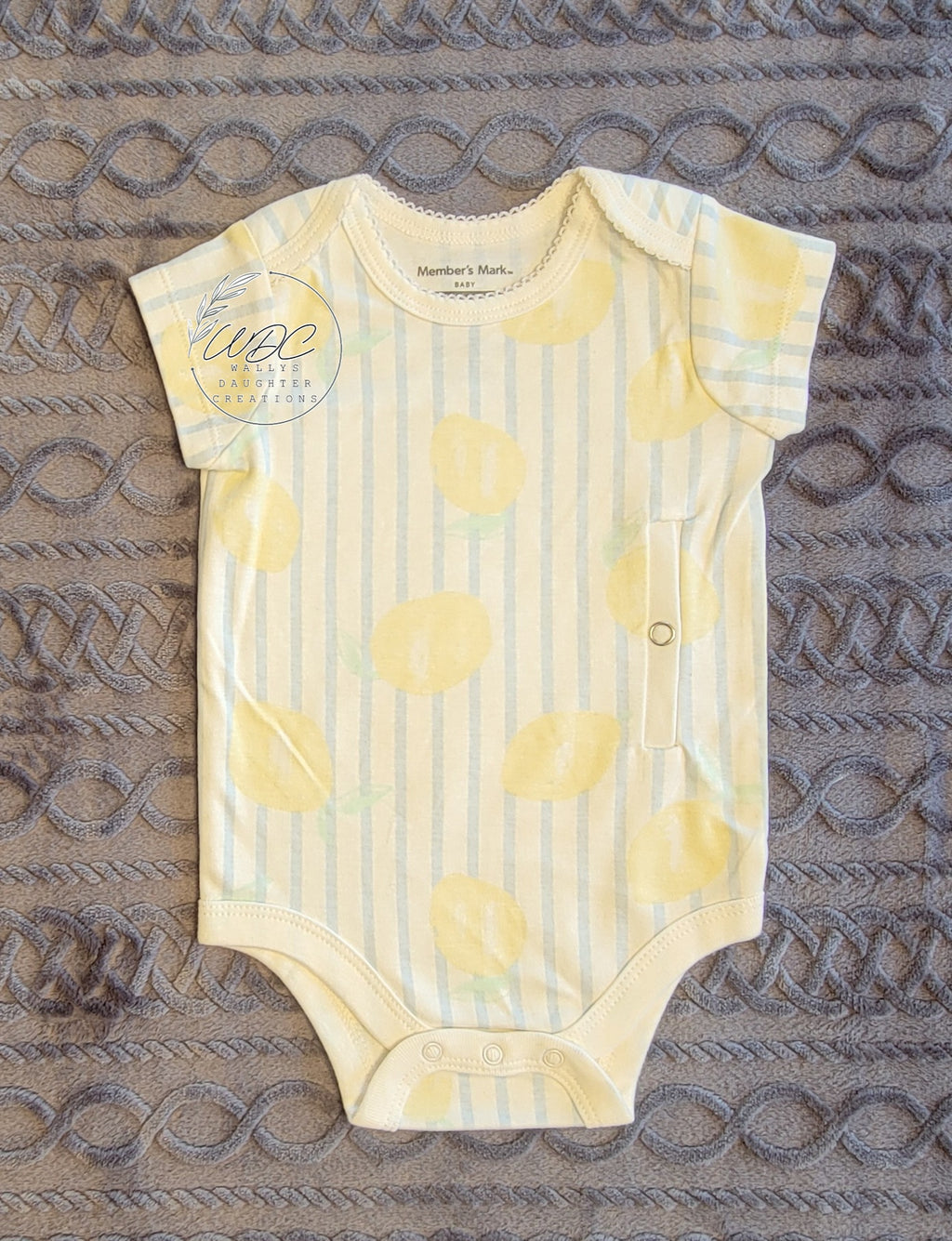Bodysuit with blue stripes and lemons with a left side gtube access opening