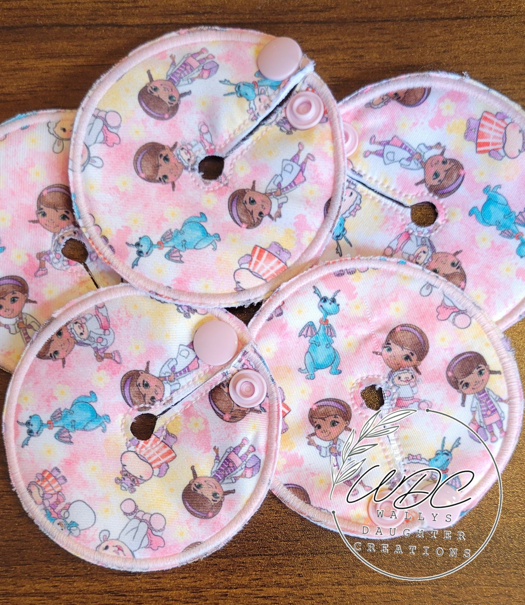 collage of pink gtube pads with character
