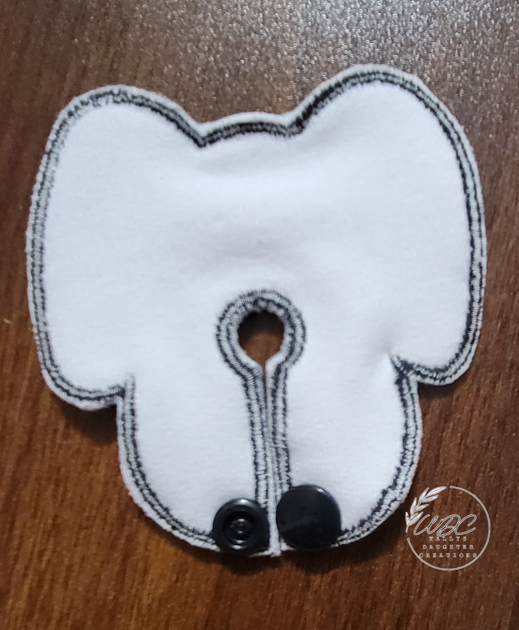 backside on dog face shaped gtube pad