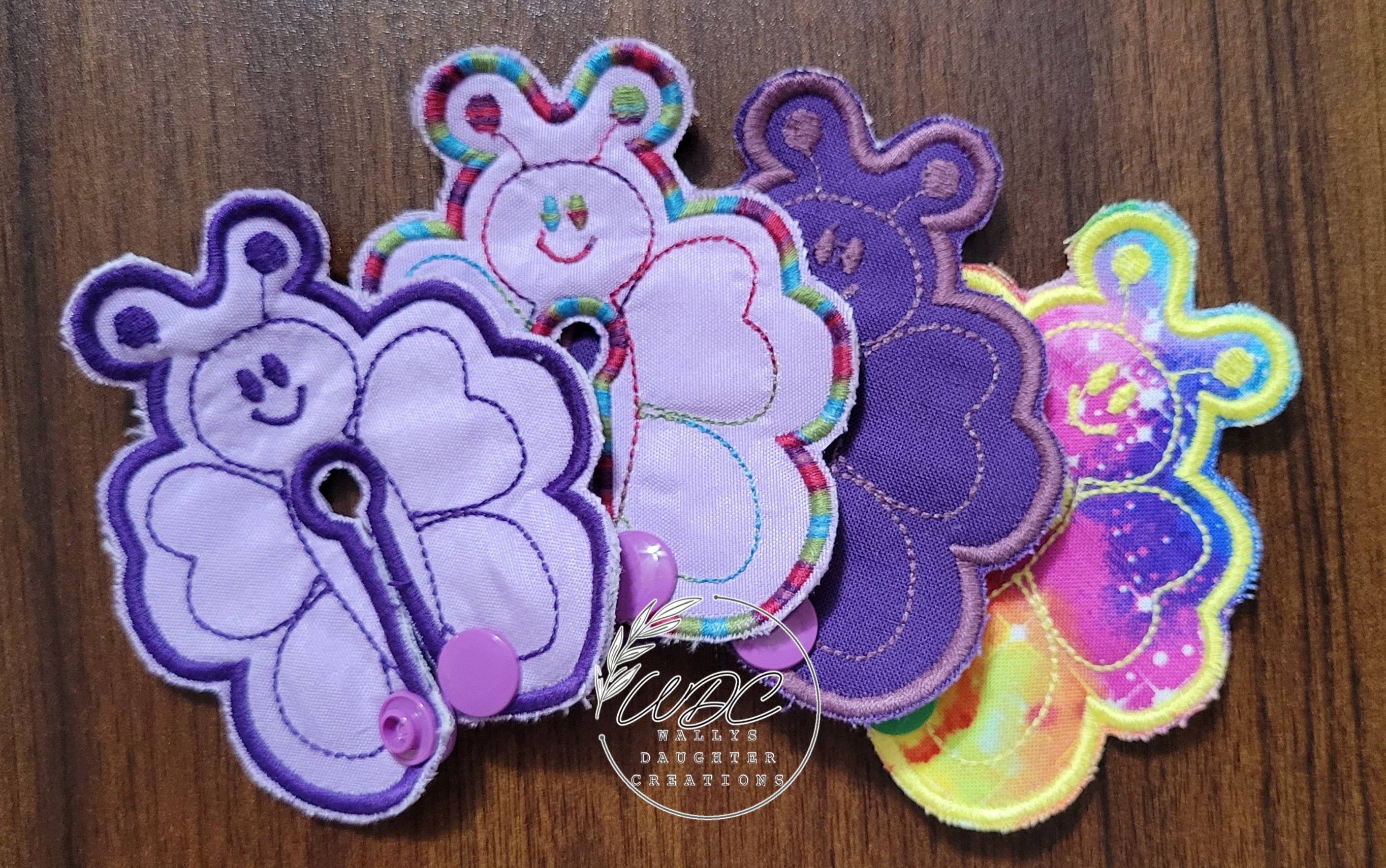 Butterfly shaped gtube pads in various colors