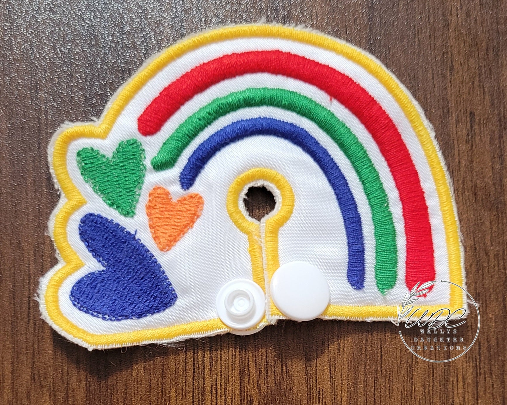Primary Colored Rainbow shaped gtube pad with hearts