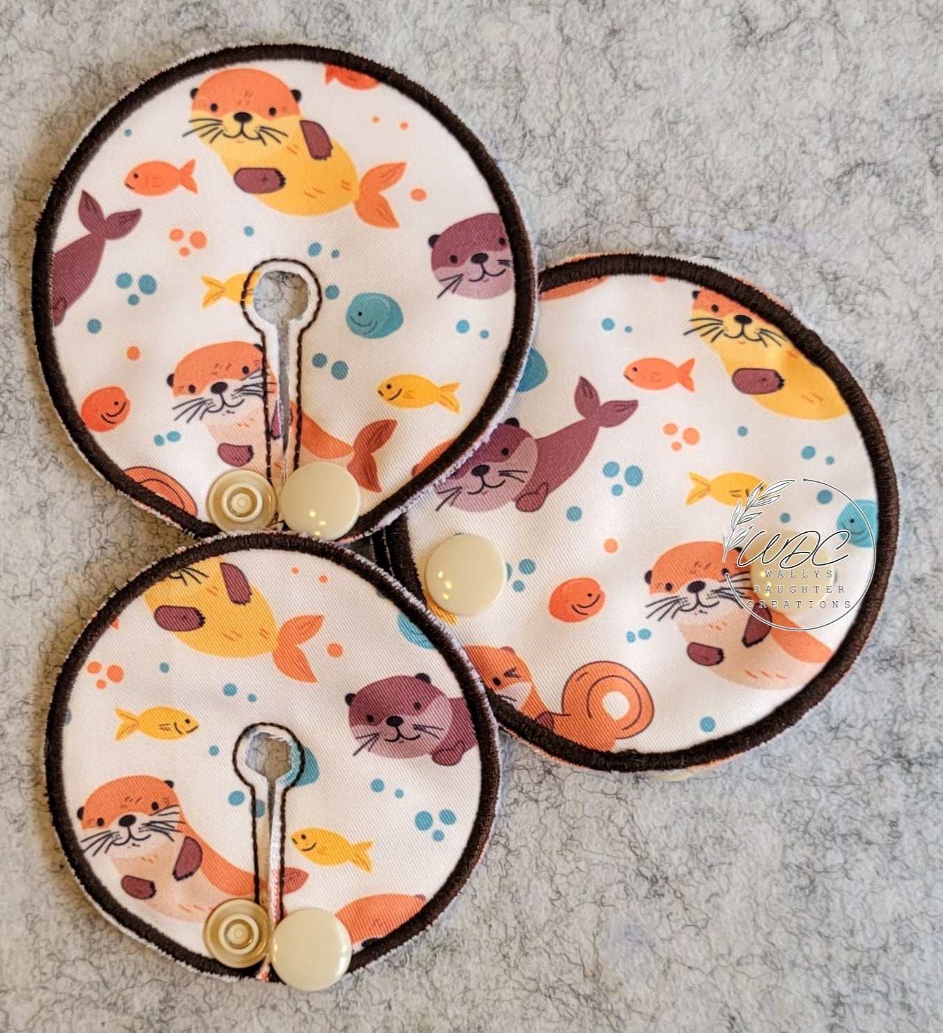 collage of different sized gtube pads with otters