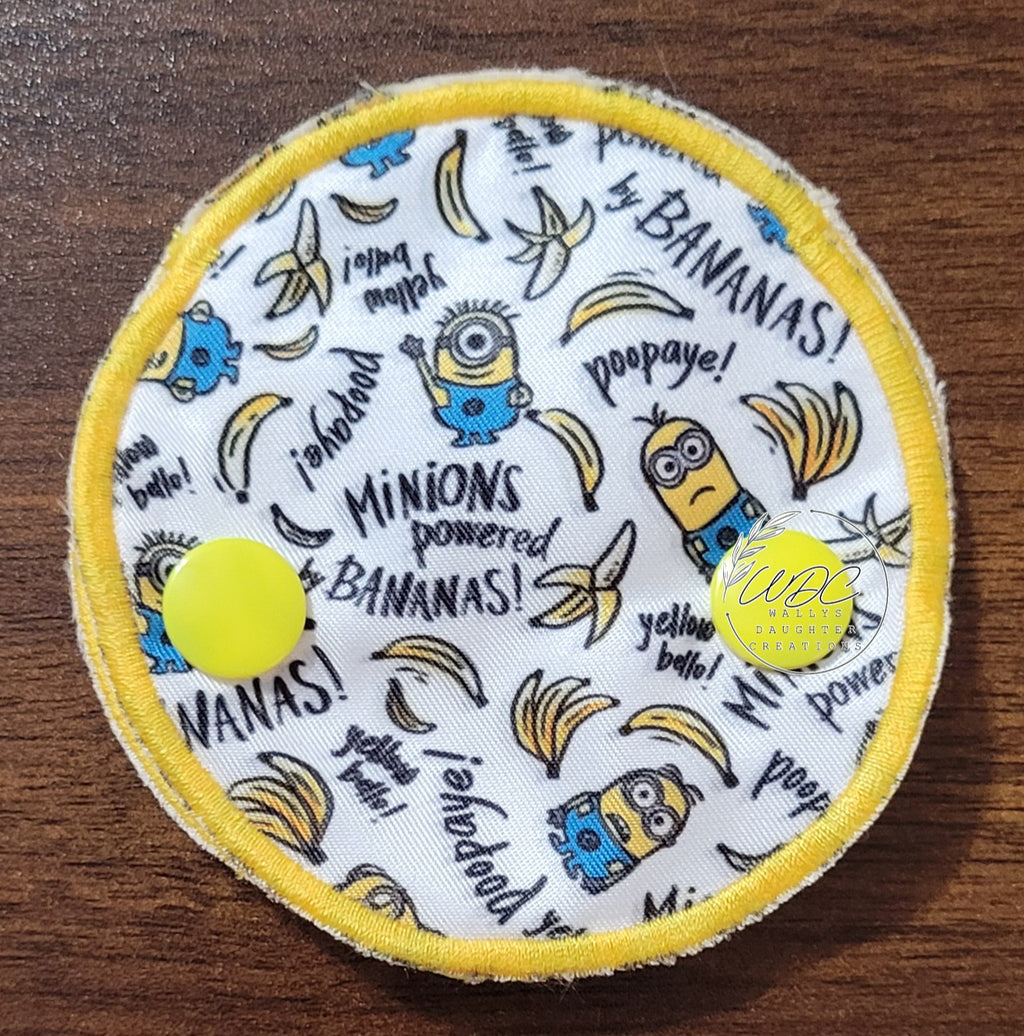 snap down covered pad with bananas and characters