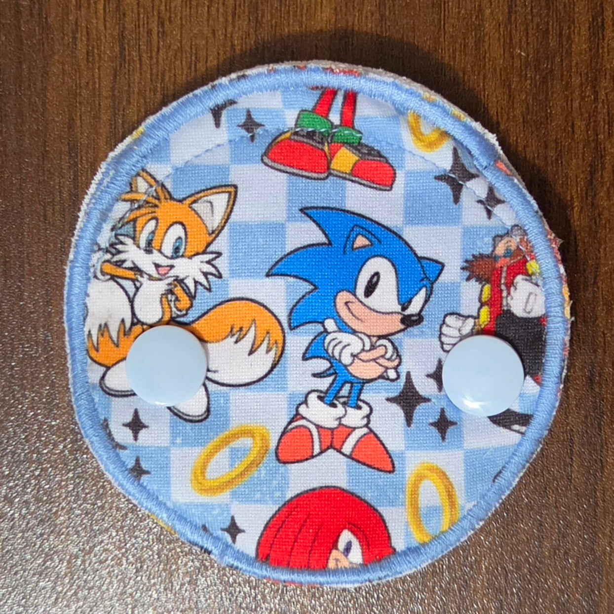 Blue Hedgehog character in a snap down pad