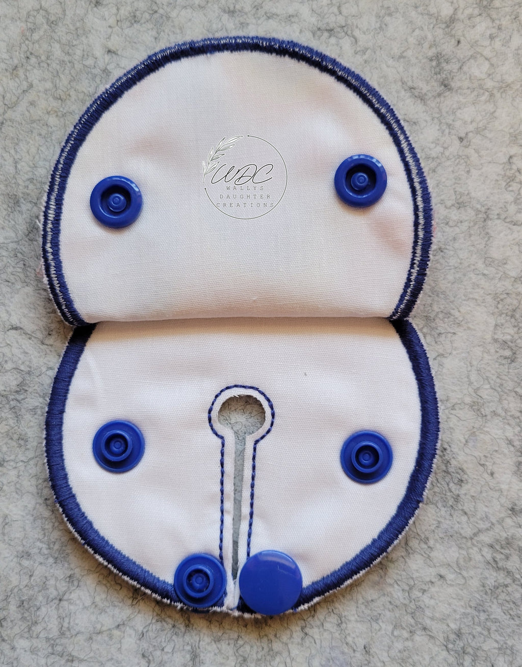 inside view of snap down pad with blue thread