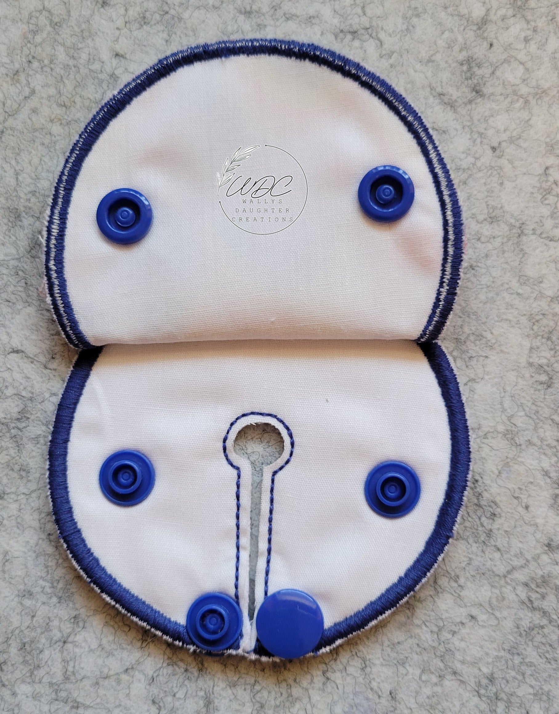 inside view of snap down pad with blue thread