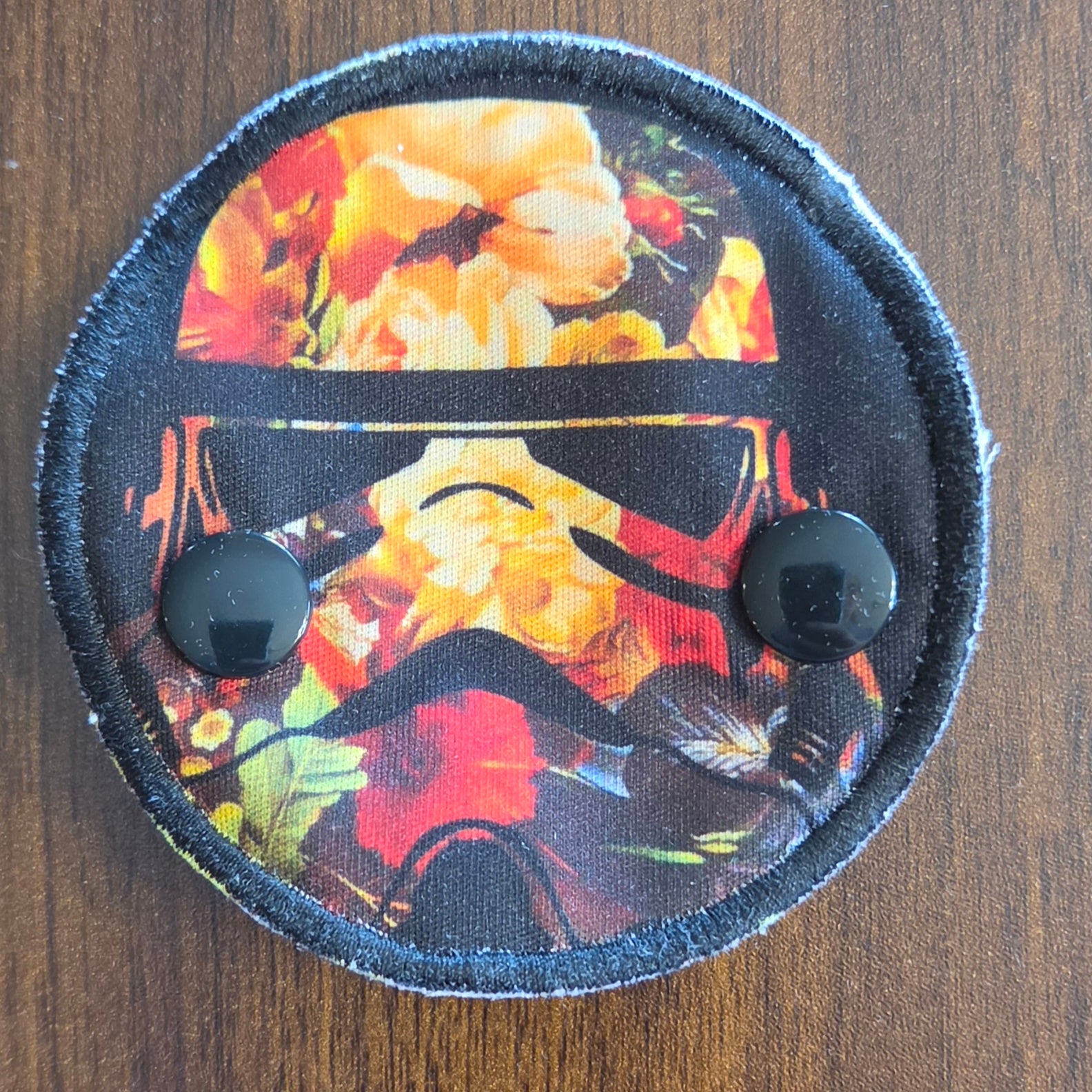 Snap down covered pad in orange trooper print