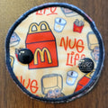 snap down covered pad with food items featuring chicken nuggets