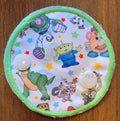 Snap down covered gtube pad with various toys and stars