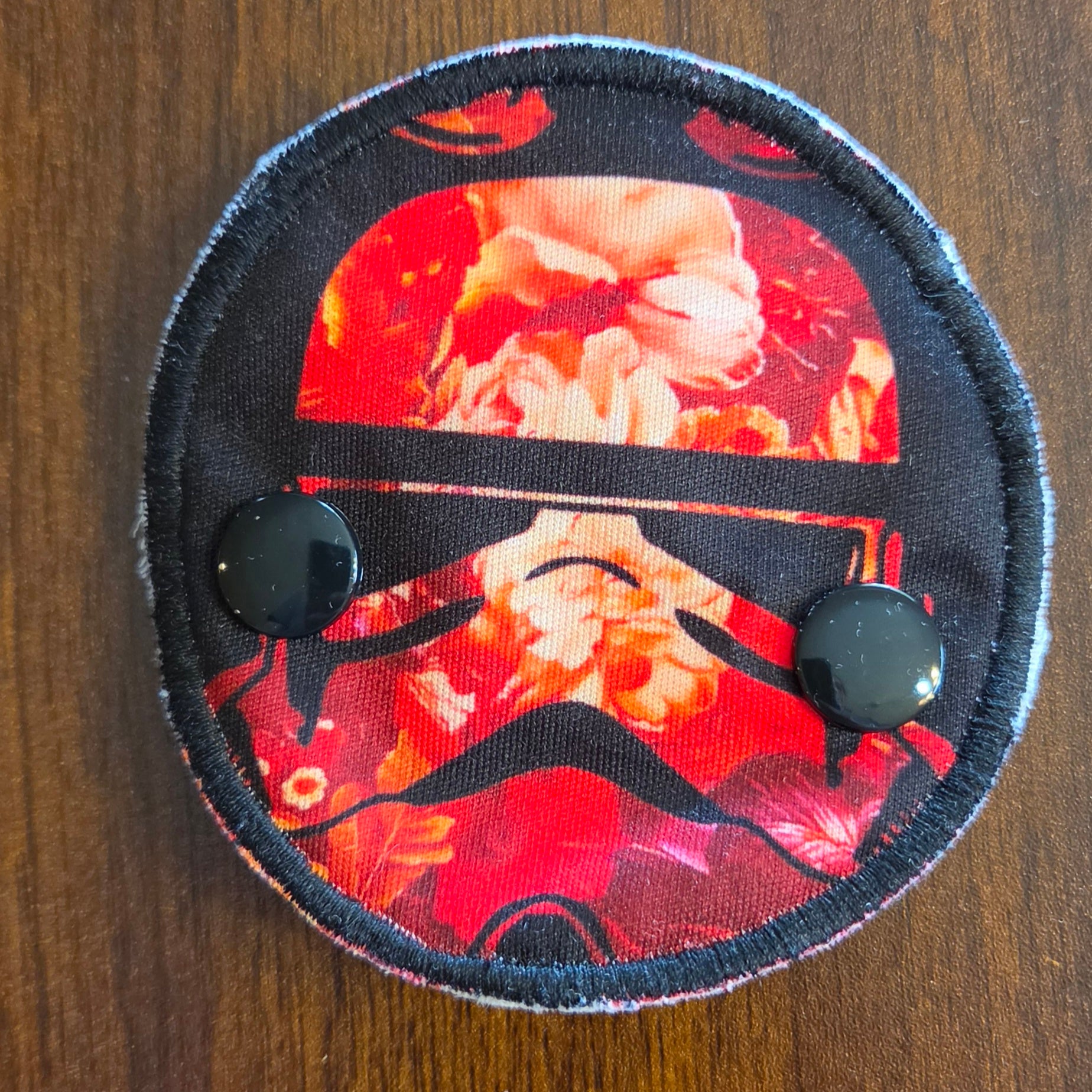 Snap down covered gtube pad with red trooper print